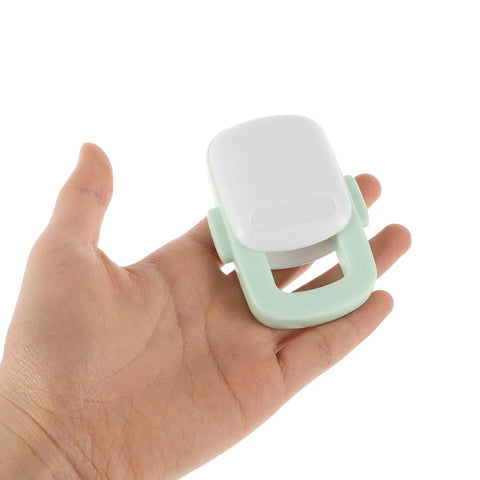Hand holding Sturdy 4 Pack Oven Door Lock For Cabinets And Appliances, Kid Safe Kitchen Safety Locks, Easy Install, Light Green