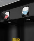 Close-up of hot and cold water taps on top loading water cooler dispenser with LED indicators