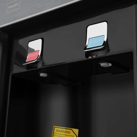 Close-up of hot and cold water taps on top loading water cooler dispenser with LED indicators