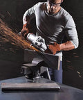 Person using XCAVATOR 4.5 Inch Grinding Wheel Surface Finishing Wheel Pack of 25 A-16-P Grit for metal edge refinement.
