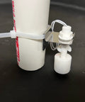 WiFi Water Level Sensor With Text And Email Alerts No Monthly Fee Battery Powered Real Time Notifications And Battery Health Status In Every Message For Easy Leak Prevention And Peace of Mind mounted on PVC pipe