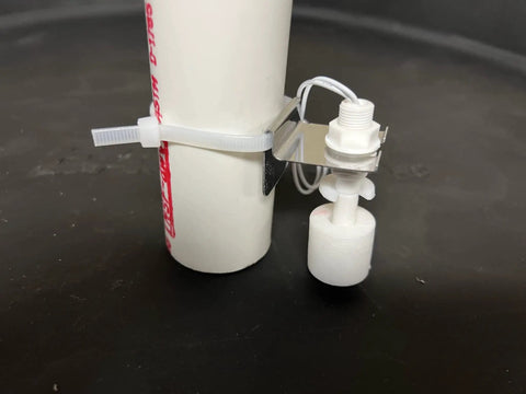 WiFi Water Level Sensor With Text And Email Alerts No Monthly Fee Battery Powered Real Time Notifications And Battery Health Status In Every Message For Easy Leak Prevention And Peace of Mind mounted on PVC pipe