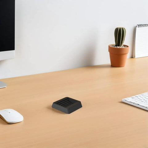 Anti Slip Pads For Chair Legs And Furniture With Wheels on wooden desk near plant and computer accessories, minimalist design.