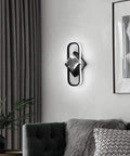 Modern Led Acrylic Indoor Wall Sconce With Dimmable Remote Control And Warm Adjustable Glow Solid Pick For Bedroom Living Room And Office Space Major Vibe Upgrader mounted beside a couch.