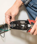 Person using Pro-Grade Wire Stripper And Ratcheting Crimper Kit For Insulated Terminals on electrical wiring