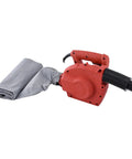 Heavy Duty 1280W Dual Purpose Air Blower And Industrial Dust Collector Fan Tough As Nails Electric Suction Machine For Quick Garage Cleanups And Grinding Removal in red, with attached grey fabric for dust collection.