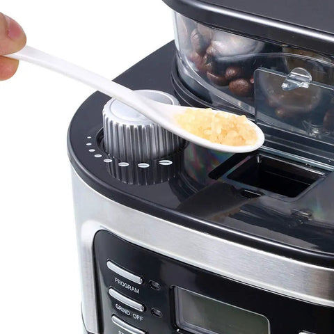 Close-up of Grind And Brew 15 Cup Coffee Maker With Timer And Auto Off Stainless Steel Black Coffee Machine adjusting settings.