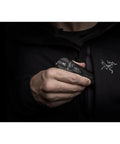 Person holding blue pocket light for go-to everyday carry, ultra bright pocket sized flashlight that fits in your hand and pocket.