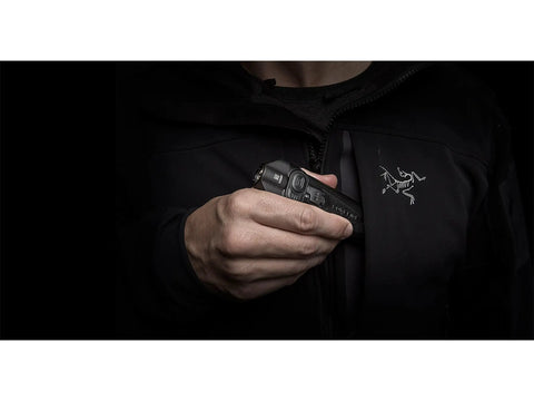 Person holding blue pocket light for go-to everyday carry, ultra bright pocket sized flashlight that fits in your hand and pocket.