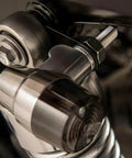 AUCELI rear turn signal mounting brackets installed on chrome motorcycle hardware; bolt and hex nut visible