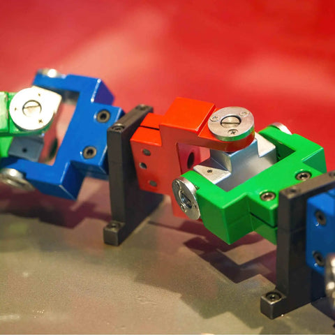 Colorful mechanical blocks on display with mounted components showcasing universal joint shafts for model cars and drones.
