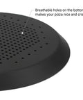 Close-up of black 16 Inch Perforated Pizza Pan With Holes For Oven, Heavy Duty Aluminum Round Crisper Baking Tray in kitchen
