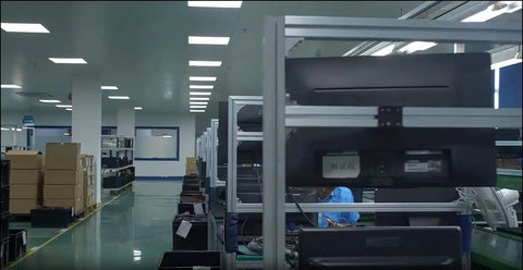 Industrial automation factory interior with worker in assembly area, focus unclear on Double Rod Pneumatic Cylinder With 40mm Bore And 75mm Stroke.
