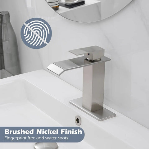 Swanky Brushed Nickel Waterfall Bathroom Faucet With Single Handle For Modern Sinks And 1 Or 3 Hole Installations on white sink