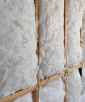 Pro Grade Fiberglass Batt Insulation R13 Rating snugly fits standard two by four interior walls, showcasing durable kraft facing.