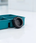 10 Pack Black Silicone Grommet Plugs With Tool Free Install Round Seal Stopper beside a blue container