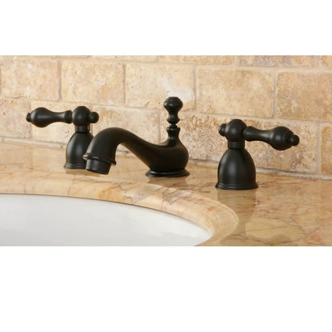 Model KS3952AL Restoration Mini Widespread Lavatory Faucet With Metal Lever Handles Polished Brass Finish on marble sink