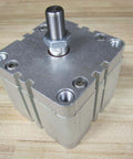 Bosch Rexroth Cylinder 0822-397-205 0822397205 showing NPT thread top view on a wooden surface
