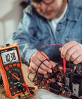 Auto Ranging Digital Multimeter For DIYers With 6000 Counts For AC DC Voltage And Current Resistance Capacitance Diode Test NCV Duty Cycle And Type K Thermocouple Probe For Quick Home And Auto Electrical Fixes in use for circuit testing