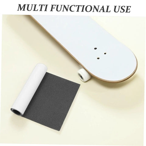 Two Pack Black PVC Grip Tape Sheets For Skateboard And Scooter Decks Weatherproof No Slip Traction Tape next to skateboard deck