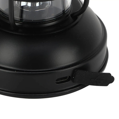 Close-up of Retro LED Camping Lantern Portable Hanging Light With Dual Power Supply showing micro USB port on black metal base.