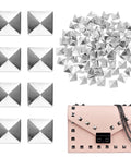 Silver pyramid flat-back studs, 200pcs for leathercraft; pile of studs and a pink bag decorated.