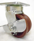 4 Inch Swivel Caster With Burgundy Ductile Steel Wheel And 7/8 Inch V Groove Offers 1500 Lbs Capacity side view with locking brake.