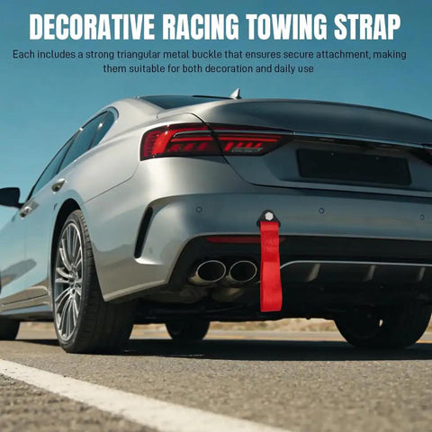 Heavy Duty Racing Tow Strap With Thick Nylon Towing Rope And Secure Hooks, Badass 2 Ton Pulling Power For Smooth Emergency Vehicle Recovery And Rear Bumper Mount In Vibrant Red attached to a silver car's rear.