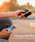 Person charging phone with 6000mAh Portable Waist Clip Fan With Necklace Mode outdoors