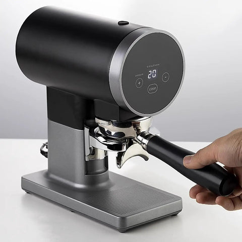 Automatic 58mm Electric Coffee Tamper With Height Adjustable Stand And Rock Solid Precision Press For Smooth Espresso Pulls, black metal finish, display panel, portafilter attached.