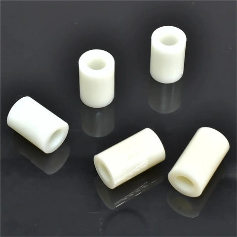 Real Deal Slick Beige Abs Plastic Spacers And Hollow Standoff Collars For Electronics Tv Brackets Diy Jewelry Crafting 500 Pack Easy Fit Rack Washers 8mm Id 16mm Od, five beige hollow standoff collars on a dark surface.