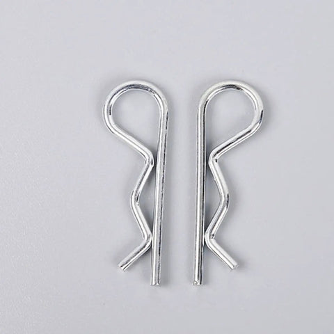 Top Rated 150 Pcs R Shape Cotter Pins Made From Durable Carbon Steel With Easy Carry Box Perfect Fastener Assortment Set For Engineering Jobs And DIY Tinkerin On Anything That Needs A Serious Hold - two silver cotter pins close-up
