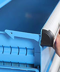Close-up of Hella Compact Metal Tool Chest Featuring A Knockout Lock And Heavy Duty Steel Frame, showcasing the edge and latch.
