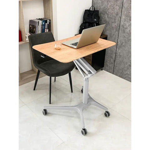 Hella Stable Mobile Standing Desk Featuring Instant Gas Spring Lift And Smooth Glide Rollers For A Total Game Changer Home Office Upgrade Or Flexible Workspace Setup In Clean Black with laptop.