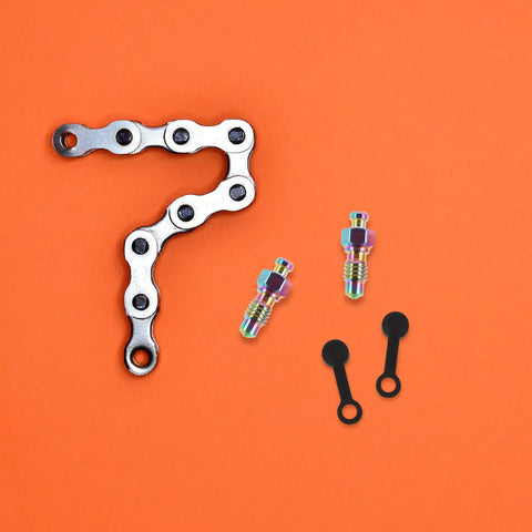 Badass Titanium Alloy Brake Bleeder Screw Set With Dust Caps For Motorcycles Mountain Road Bikes Dirt Rig Slick Fluid Bleed No Sweat Backyard Mechanic Must Have Gear, featuring screws and dust caps.