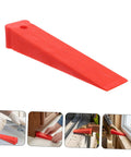 Red Plastic Leveling Wedges And Reusable Gap Filler Shims For Bullseye Door And Window Alignment close-up view of red shim