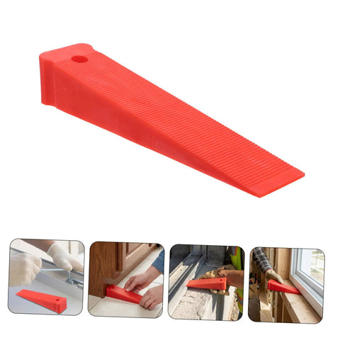 Red Plastic Leveling Wedges And Reusable Gap Filler Shims For Bullseye Door And Window Alignment close-up view of red shim