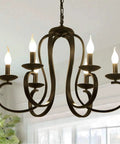 Six Light Black Candle Style Chandelier For Farmhouse And Dining Room Vintage French Country Metal Pendant Light With Adjustable 25.5 Inch Chain Ideal For Kitchen Island And Foyer Dimmable E12 Bulbs Not Included displayed indoors.