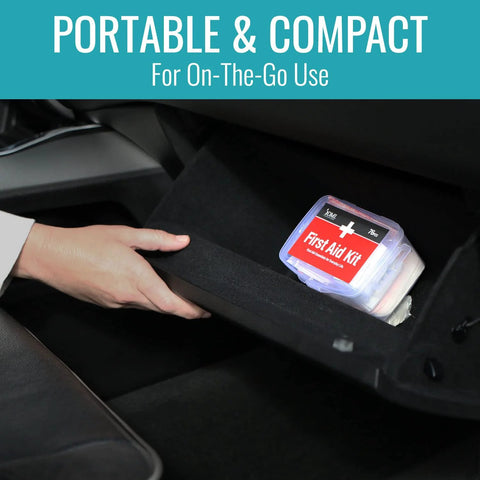 DMI 76-piece first-aid kit in a compact clear plastic case with a red label in a car glove box