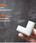 Hand holding Slimfit Corner Edge Protector For Baby Proofing with soft NBR foam, oyster white finish. Safe, clean, no glue marks.
