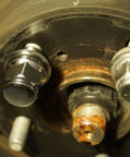 Close-up of M12x1.5 Wheel Lug Nut Stud Set 37mm 4 Pieces Compatible With Toyota, showing mounted lug nut on wheel hub.