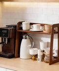 Natural Bamboo Coffee Station Organizer, 2-Tier Wooden Counter Shelf For Bar Gear And Syrup Bottles on kitchen counter.