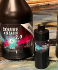 Squire Two Zero Reloaded Pro Grade Sealer For Concrete Epoxy Natural Stone Vct Lvt Lvp Tile And Grout Substrates With Gloss Finish One Quart Coverage Up To 250 Sqft displayed in large and small bottles.