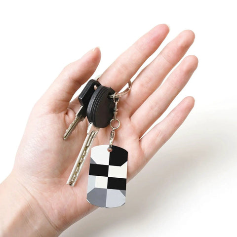 Heavy Duty Aluminum Keychain With Black And White Piano Plate Grid Print Rectangular Steel Keyring Built Tight For Everyday Carry Clean Aesthetic Daily Driver Gift Ready in hand with car keys.