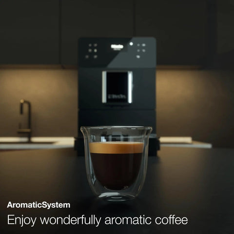 Kick Back And Sip Perfection With This Ultra Quiet Fully Automatic Bean To Cup Coffee And Espresso Machine Featuring A Silent Steel Grinder And Hassle Free One Touch Milk Frother For Serious Barista Level Coffee At Home - espresso in clear glass cup.