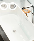 Heavy Duty Rubber Drain Stopper With Sturdy Pull Ring, Six Piece Set Of White Sink Plugs That Slickly Fit Most Bathtub And Kitchen Drains Daily in a modern white bathtub.
