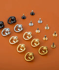 Top Tier 20 Pack Solid Brass Ball Chicago Studs Heavy Duty Screw Rivets With D Rings Badass Hardware For Leathercraft Belt Straps Wallet Chains And Diy Gear Gilt Gold Small assorted black, silver, and gold rivets on orange background