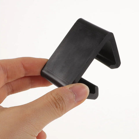 Hand holding Ganazono 12 Pieces Sectional Sofa Clips Fasteners For Outdoor Rattan Furniture in black