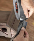 Person tearing Ferociously Strong Duct Tape 105 Yards Triple Pack Gunmetal Gray for indoor outdoor repairs, premium adhesive.