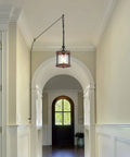 Cozy Farmhouse Style Plug In Pendant Light With Rustic Wood And Glass Cylinder hanging in hallway, bronze finish